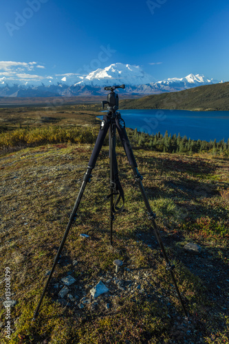 AUGUST 28, 2016 - Photographer poses at Wonder Lake, Mount Denali, Kantishna, Alaska