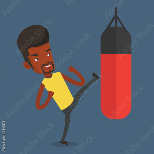 Man exercising with punching bag.