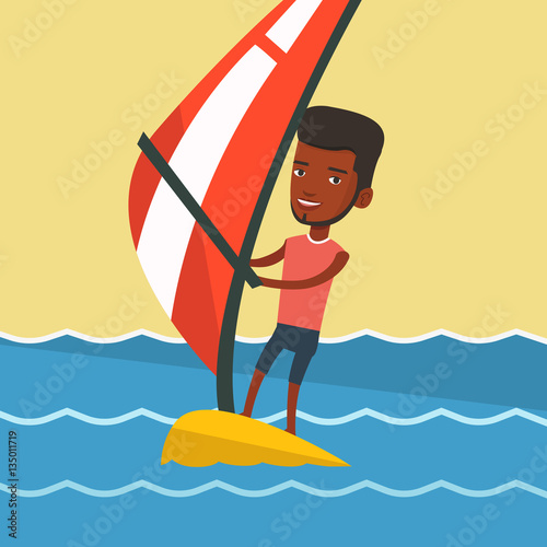 Young man windsurfing in the sea.