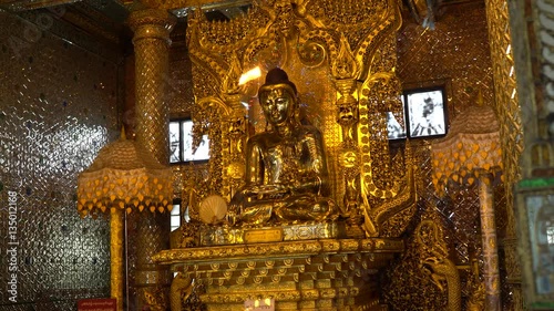 The golden image of Buddha in Botahtaung Pagoda in Yangon, Myanmar. photo
