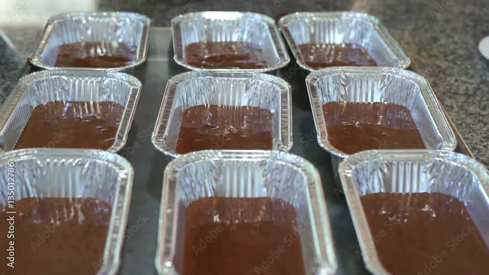 Close-Up of Women baker making homemade chocolate cake in bowl at home. Close-Up of Women baker making homemade chocolate cake in bowl at home.