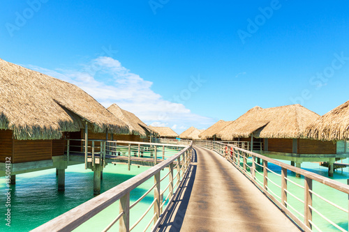 Traditional over water villas on a tropical lagoon of Bora Bora © 18042011