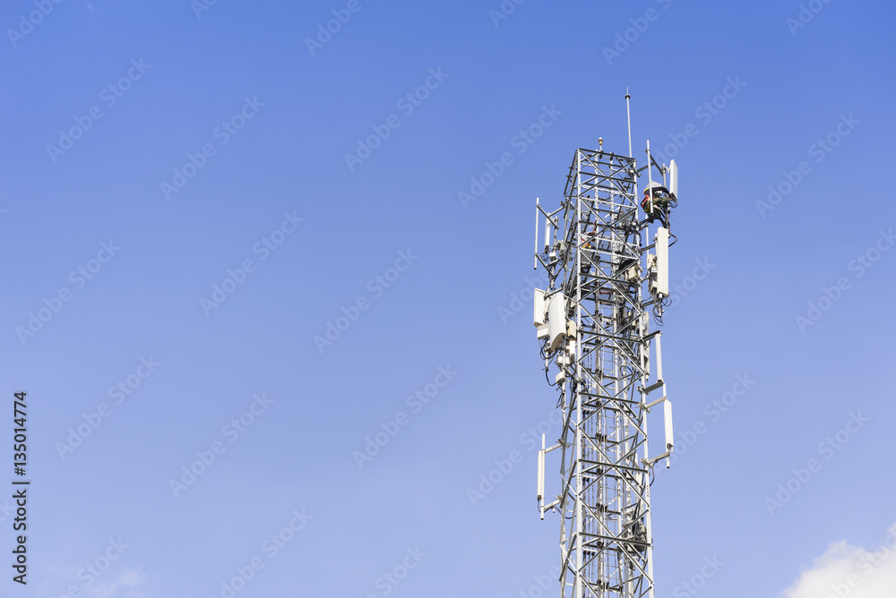 The telecommunication tower with the technician man who change spare part The telecommunication tower with the technician man who change spare part