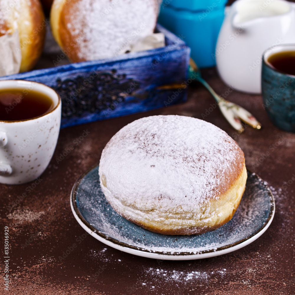 Traditional donuts with powdered sugar Traditional donuts with powdered sugar