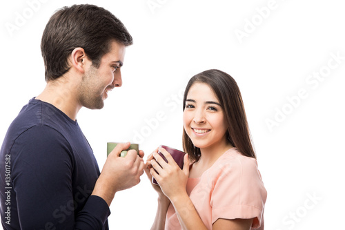 Pretty girl drinking coffee with her boyfriend