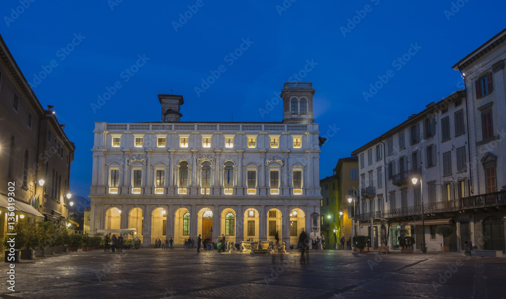 Bergamo - Old city (Citta Alta). One of the beautiful city in Italy. Lombardia. Landscape on the old main square (called Piazza Vecchia), the public library (called Angelo Mai) and Contarini fountain.