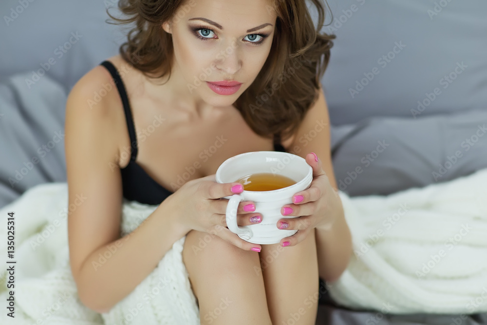 Woman lying on the bed in the morning Woman lying on the bed in the morning