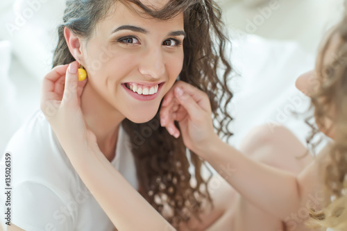 Woman wearing jewelry earrings 