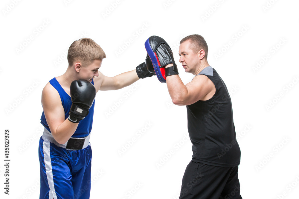 Young boxer working out with coach Young boxer working out with coach