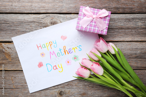 Fototapeta Naklejka Na Ścianę i Meble -  Bouquet of tulips for happy mother's day on grey wooden table