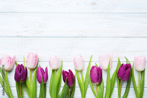 Bouquet of tulips on a white wooden table