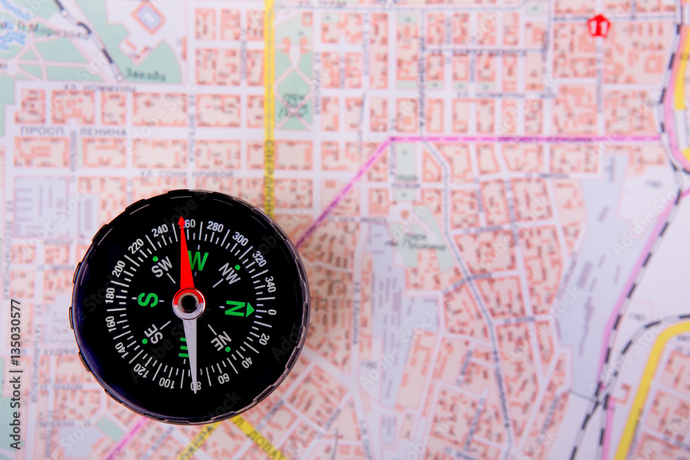 compass on a city map compass on a city map
