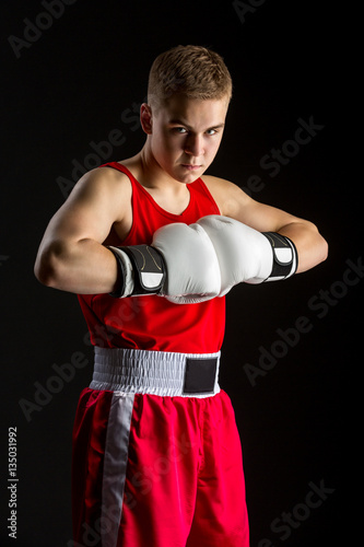 Young boxer sportsman in red sport suit © svetography