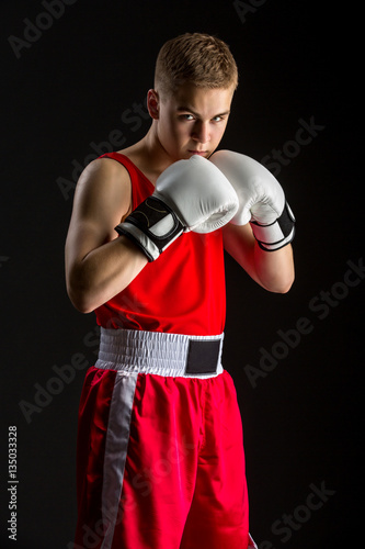 Young boxer sportsman in red sport suit © svetography
