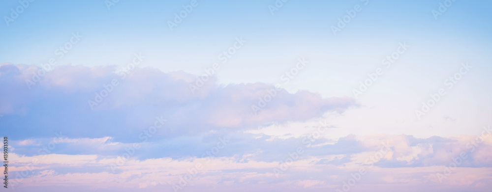 Sky background on sunset. Nature composition. Panoramic sunset sky background. Sunrise sky with lighted clouds. Beauty evening sunrise. 