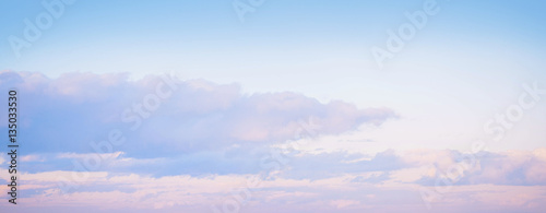 Sky background on sunset. Nature composition. Panoramic sunset sky background. Sunrise sky with lighted clouds. Beauty evening sunrise. 