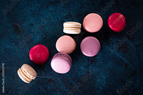 colorful macaroons on blue background,top view ,Holiday food concept
