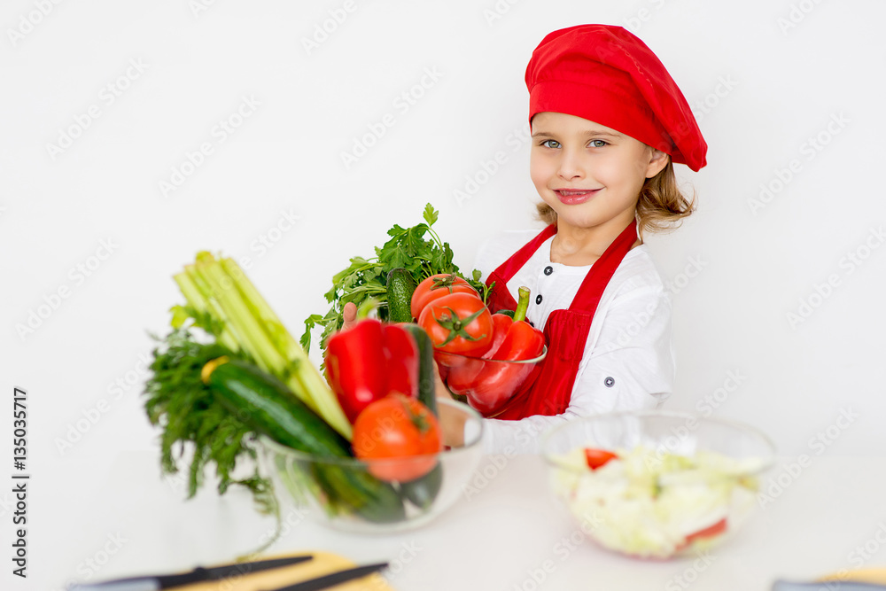 little girl chef is going to prepare a salad isolated little girl chef is going to prepare a salad isolated