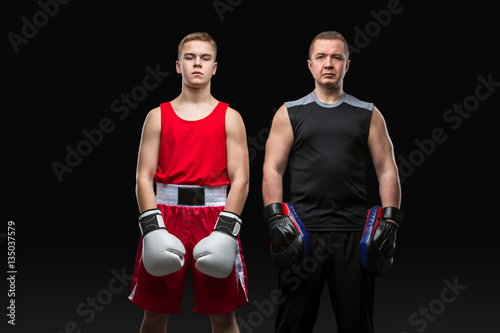 Young boxer working out with coach © svetography