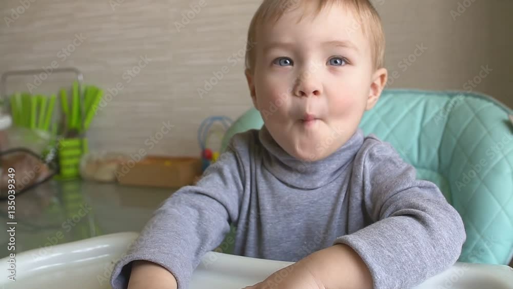 Happy baby sitting in the kitchen chair Happy baby sitting in the kitchen chair