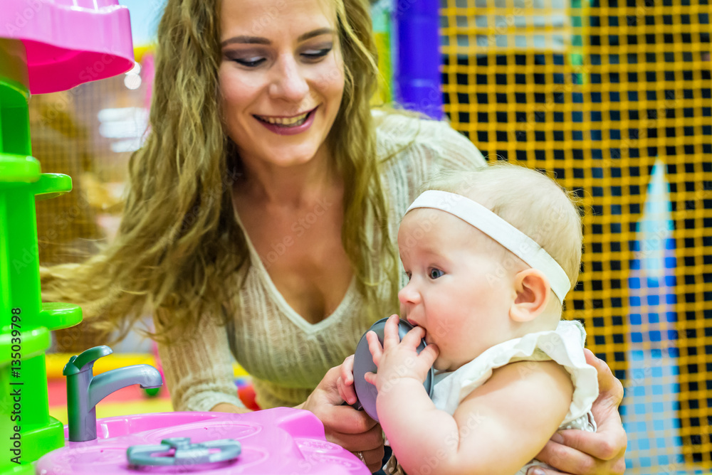 mother and child play in the children's room mother and child play in the children's room
