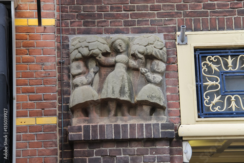 Ancient building with bas-relief in historic centre of Utrecht, the Netherlands