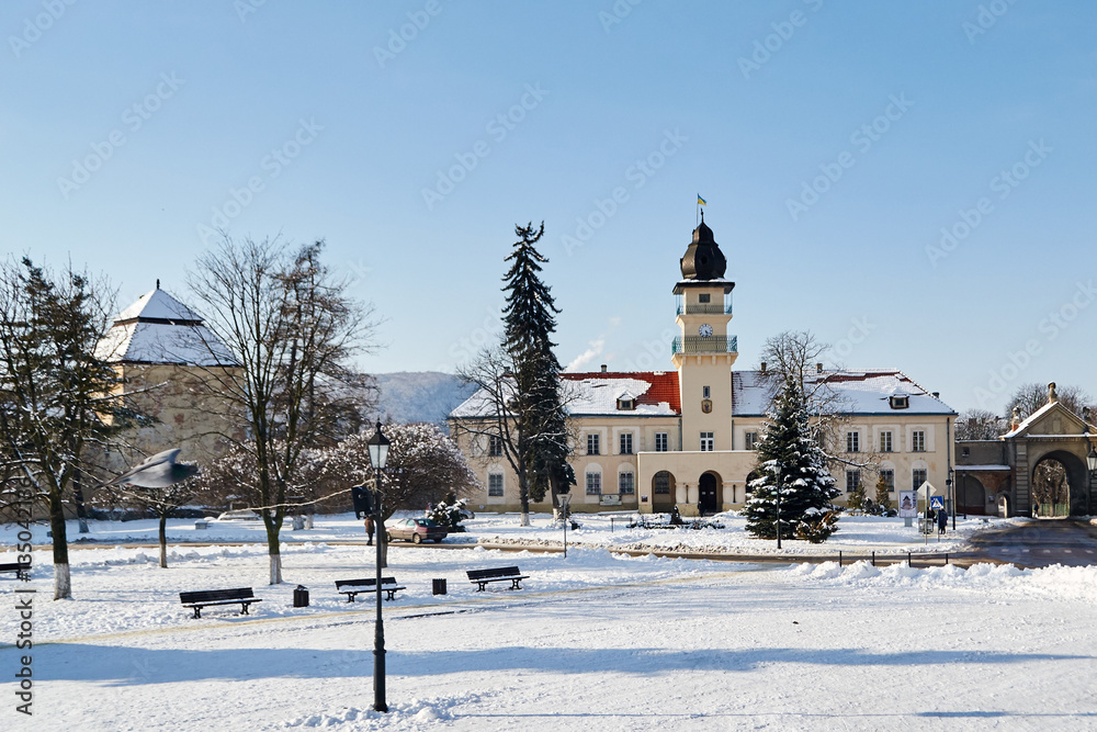 city hall on a blue sky background in winter in Zhovkva,Ukraine