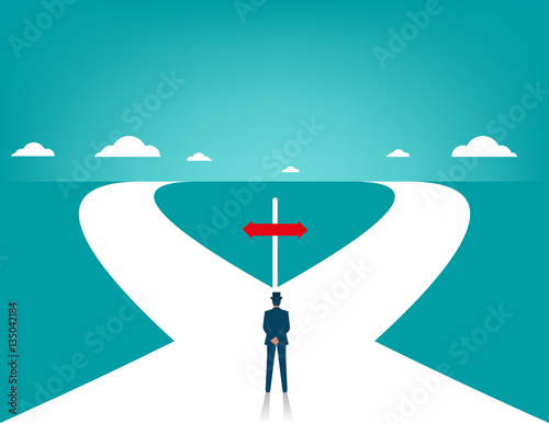 Businessman in front of two roads