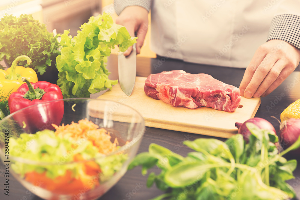 cook is ready for raw meat preparation cook is ready for raw meat preparation