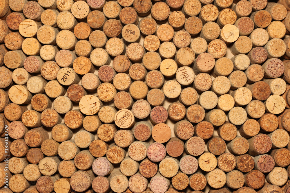 Background of used wine corks. Wall of many different wine corks. Closeup of wine corks. Background of used wine corks. Wall of many different wine corks. Closeup of wine corks.