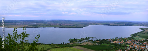 Moravian dam, town and vineyards. Panoramic photo.
