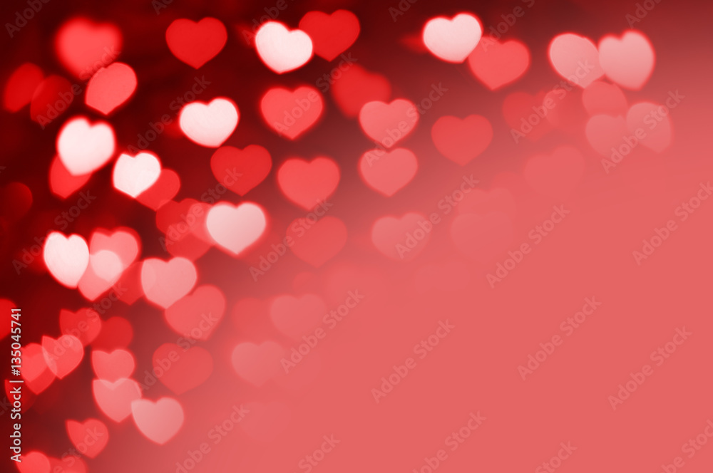 Red and white hearts bokeh as background with copy space