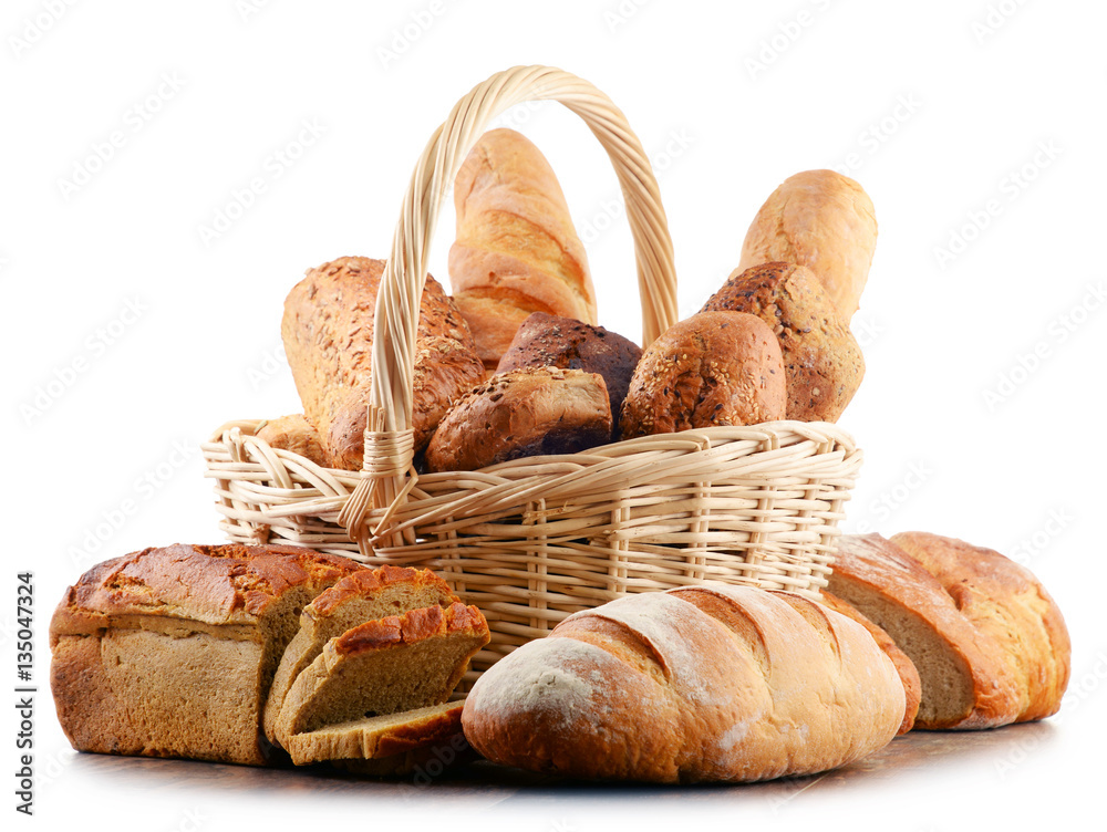 Wicker basket with assorted baking products isolated on white