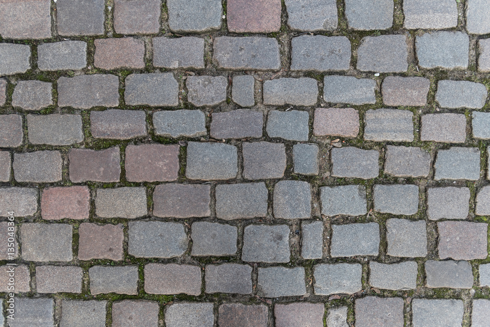 Fototapeta premium cobblestone street surface background pattern