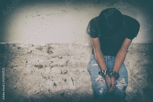 hopeless man hands tied together with rope photo