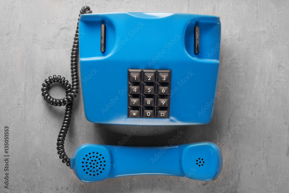 handset from landline phone on the background wall handset from landline phone on the background wall
