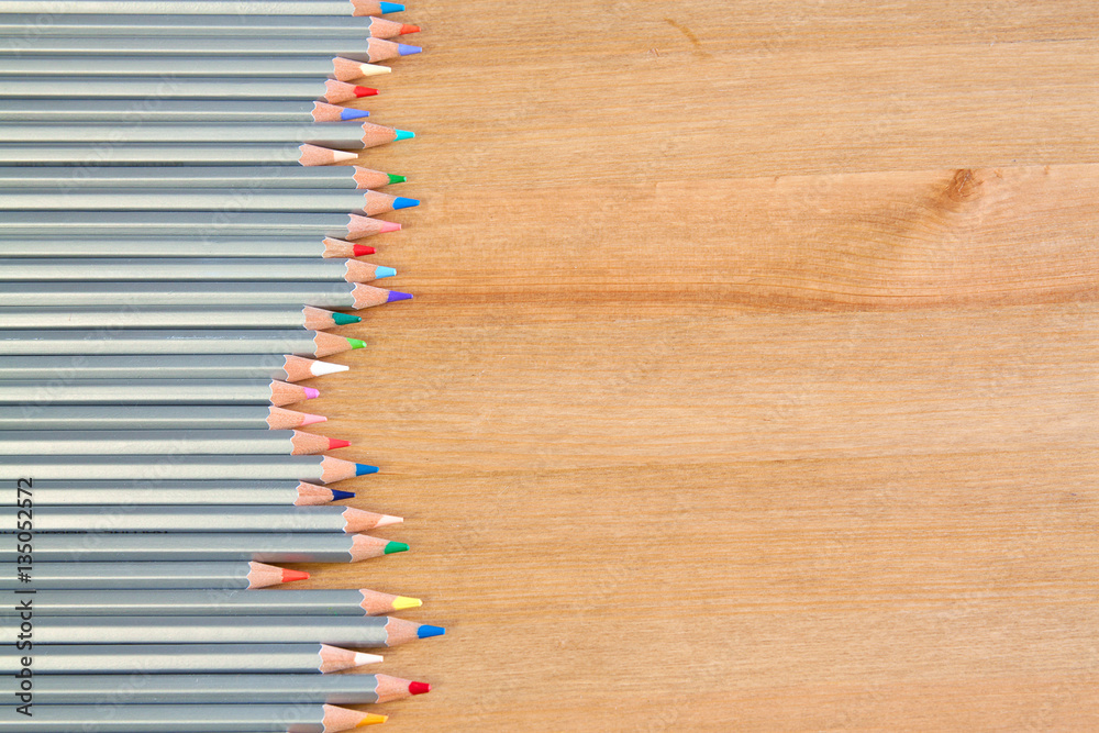 colorful pencils on the wooden table. View from above colorful pencils on the wooden table. View from above
