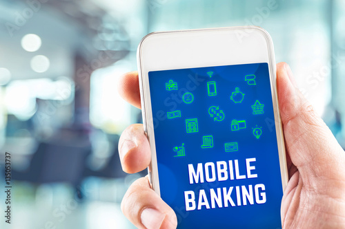 Close up hand holding mobile with mobile banking word on screen