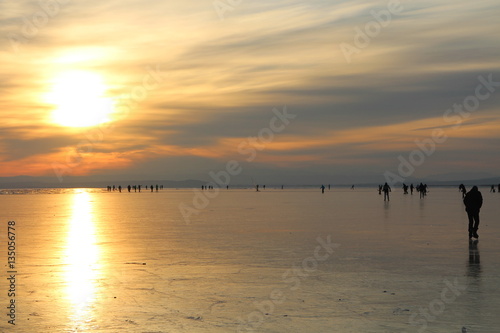 Evening with skaters on lake Neusiedl, Austria