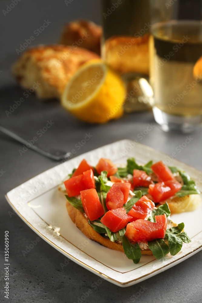 Plate with traditional Italian bruschetta on table Plate with traditional Italian bruschetta on table