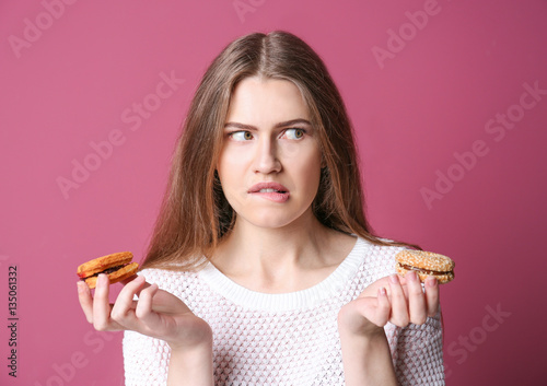Young woman making choice b...