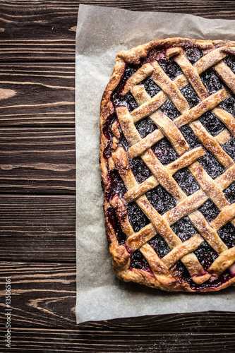 Homemade berry pie on a wooden background