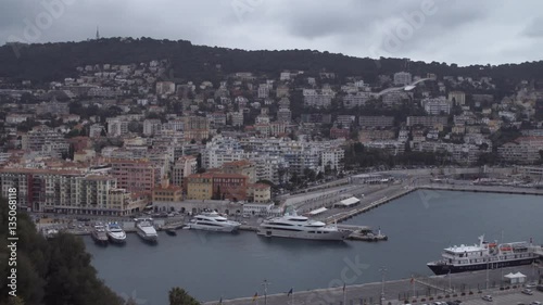 Wallpaper Mural City view with pier on the Cote d'Azur with different yachts and boats. Cityscape with beautiful buildings in autumnal cloudy day. nice france. Torontodigital.ca