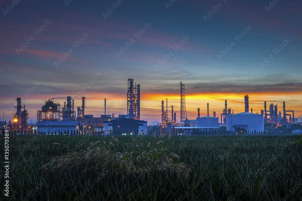Silhouette of petrochemical plant or Oil and gas refinery at sunrise
