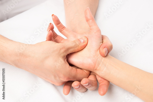 massage hands at certain points, hands close-up photo