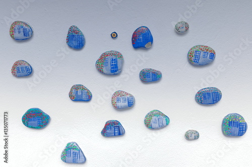 Small stones painted with blue-red-green motifs. Blue White hotel-Çirali-Turkey. 0416 photo