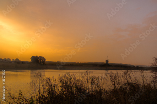 Dutch landscape near Kessel. Sunrise  dutch mill.