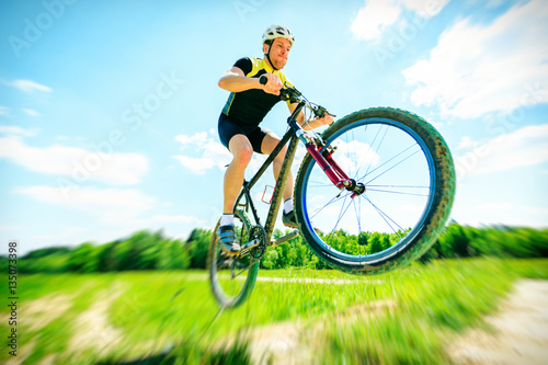 Young Man Riding His Mountain Bike