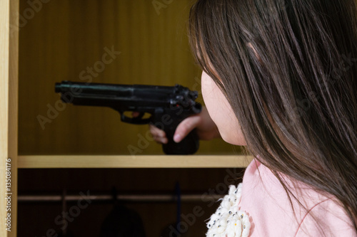 Young girl finds gun in closet