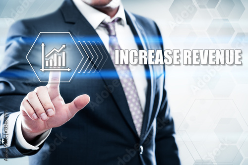 Business, technology, internet concept on hexagons and transparent honeycomb background. Businessman pressing button on touch screen interface and select increase revenue